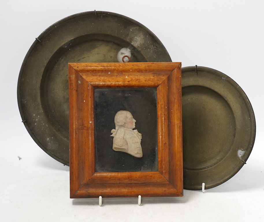 Naval interest; a maple framed coloured waxed profile bust of Admiral Lord Howe, c.1800, together with two pewter plates stamped, London, wax relief including frame 15.5cm wide, 18cm high. Condition - fair, considering a